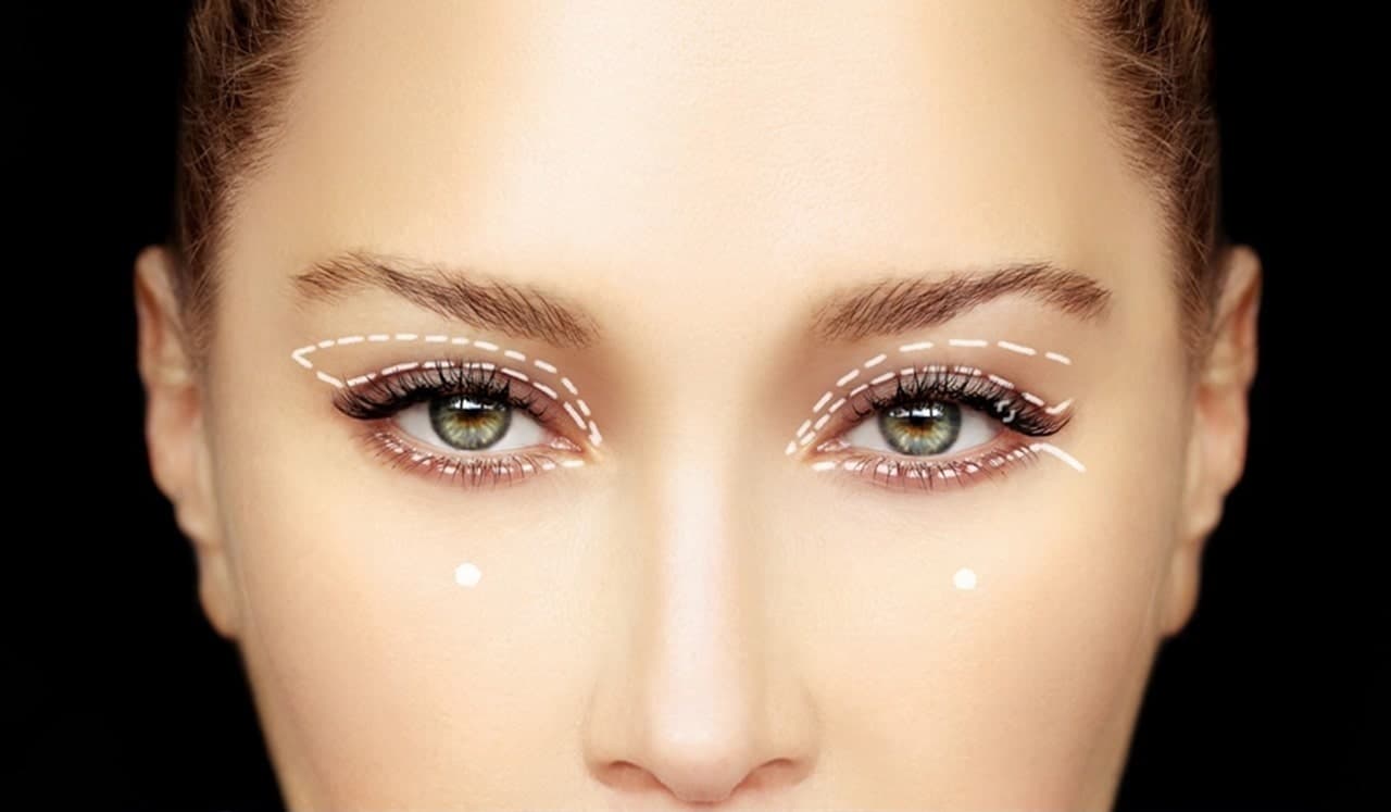 Woman with refreshed appearance after eyelid lift surgery